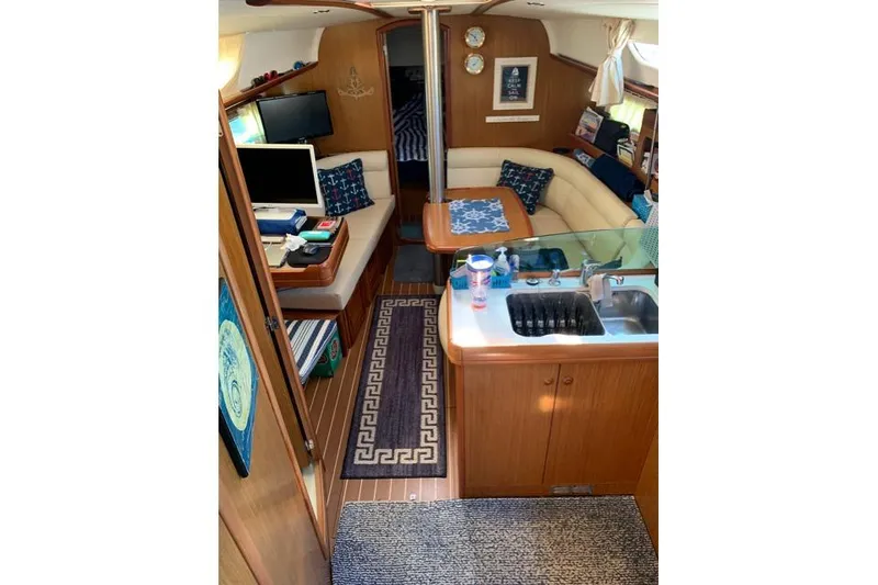 Slide: The Image of Interior of 2007 Jeanneau Sun Odyssey 36i sailboat with cozy seating and modern amenities. - 19
