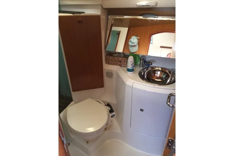Slide: The Image of Compact bathroom in 2007 Jeanneau Sun Odyssey 36i yacht with sink and toilet. - 23