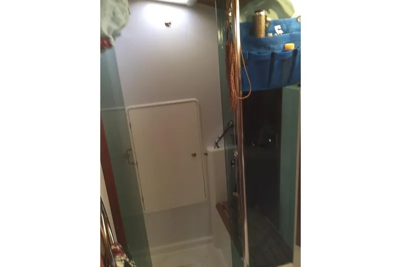 Slide: The Image of Interior of 2007 Jeanneau Sun Odyssey 36i sailboat bathroom with storage and shower. - 24