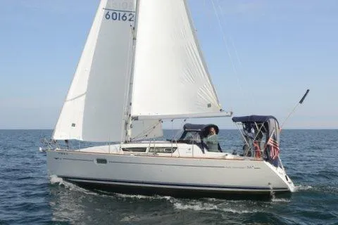 Slide: The Image of 2007 Jeanneau Sun Odyssey 36i sailing on open water under clear skies. - 3