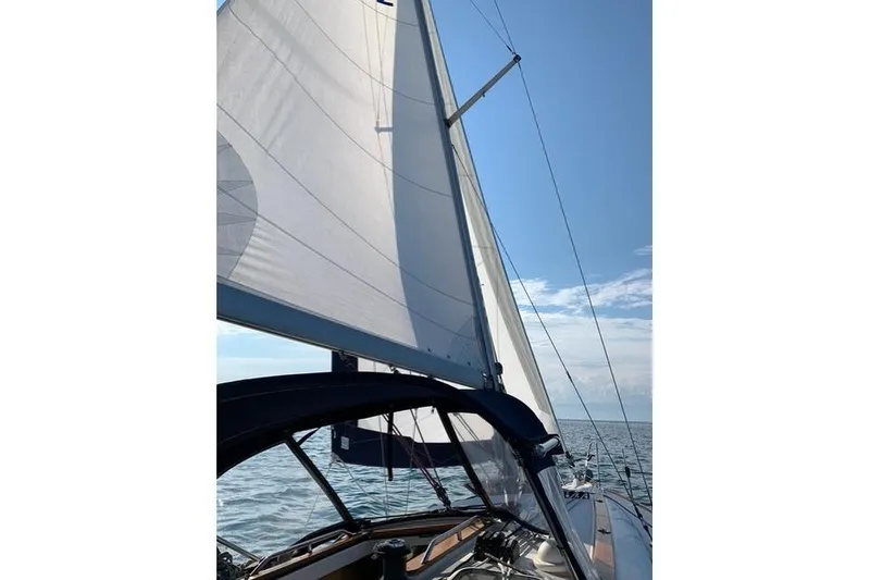 Slide: The Image of Sailing on a 2007 Jeanneau Sun Odyssey 36i with full sails under a clear blue sky. - 4