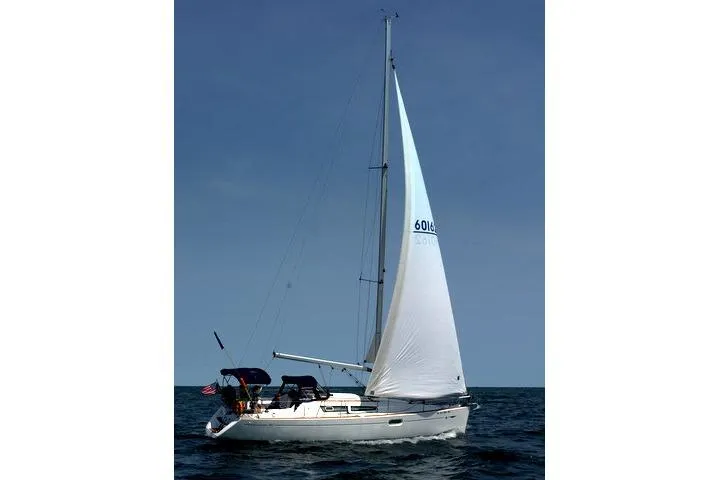 Slide: The Image of 2007 Jeanneau Sun Odyssey 36i sailing on open water under clear skies. - 5