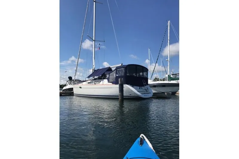 Slide: The Image of 2007 Jeanneau Sun Odyssey 36i sailboat docked in marina under clear blue sky. - 7