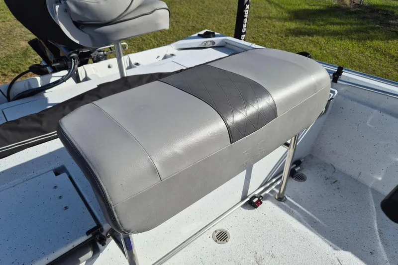 Slide: The Image of 2021 Xpress XP20CC boat seat with gray upholstery and diamond pattern detail. - 10
