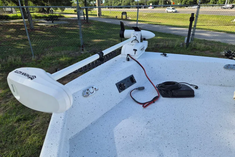 Slide: The Image of 2021 Xpress XP20CC boat with Minn Kota trolling motor on deck. - 16