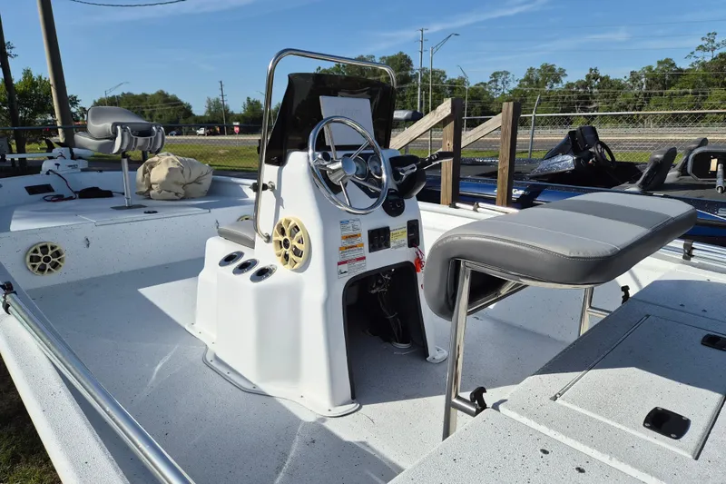 Slide: The Image of 2021 Xpress XP20CC boat interior with steering console and seating. - 4