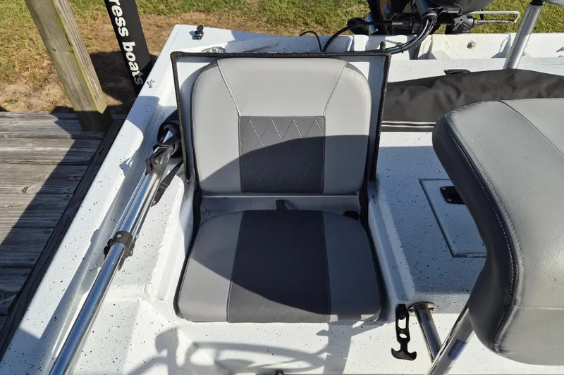 Slide: The Image of 2021 Xpress XP20CC boat seat with gray upholstery and fishing rod holder. - 7