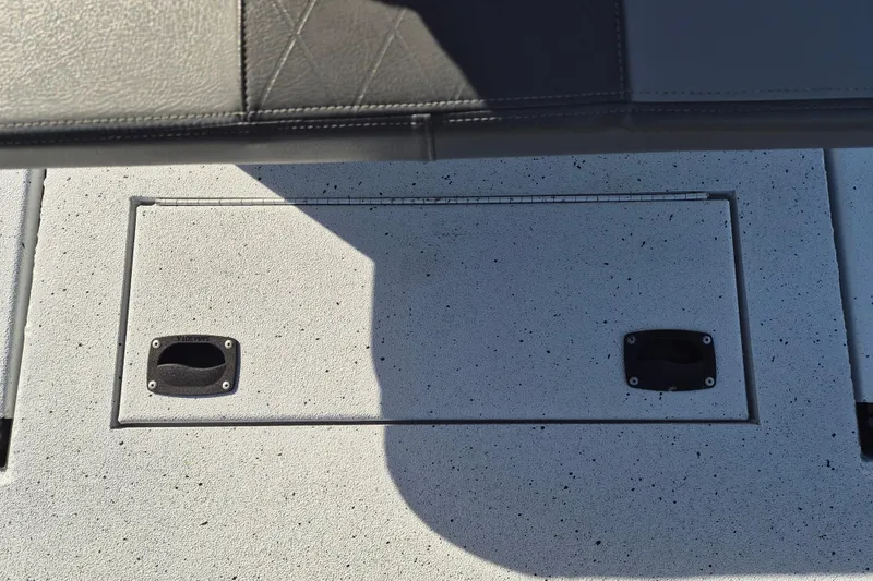 Slide: The Image of 2021 Xpress XP20CC boat deck with storage hatch and textured surface. - 9