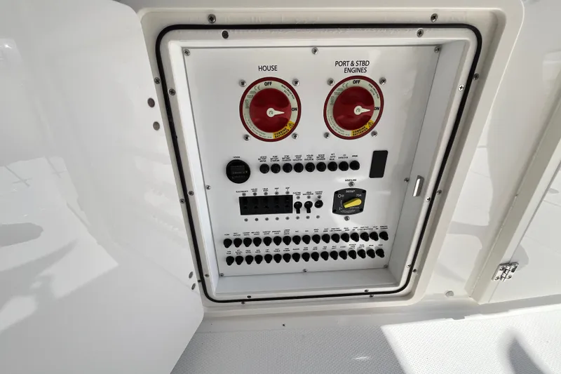 Slide: The Image of Electrical control panel on a 2027 Pursuit DC 326 Dual Console boat. - 6