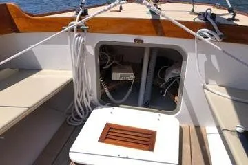Slide: The Image of 1997 Stuart Marine Knockabout sailboat interior with ropes and storage compartment. - 4