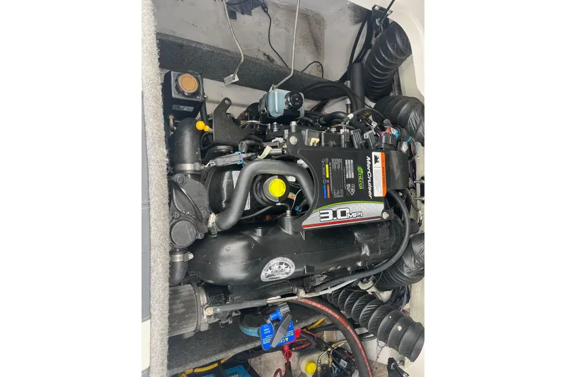 Slide: The Image of 2014 Glastron GT 185 boat engine, featuring a 3.0 MPI MerCruiser motor. - 13