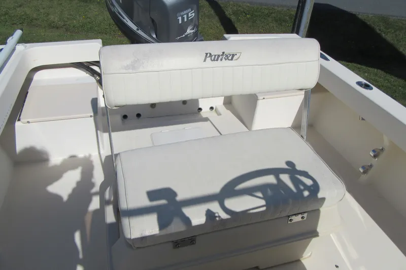 Slide: The Image of 2003 Parker 1801 Center Console boat interior with Yamaha 115 engine. - 10