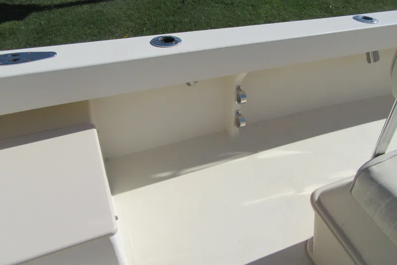 Slide: The Image of 2003 Parker 1801 Center Console boat interior with seating and rod holders. - 11