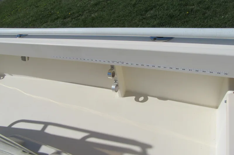 Slide: The Image of 2003 Parker 1801 Center Console boat interior with measuring tape on side. - 12