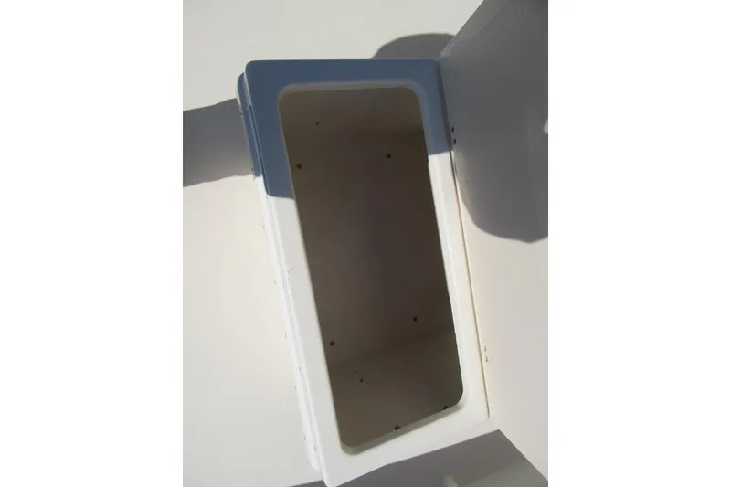 Slide: The Image of Open storage compartment on a 2003 Parker 1801 Center Console boat. - 20