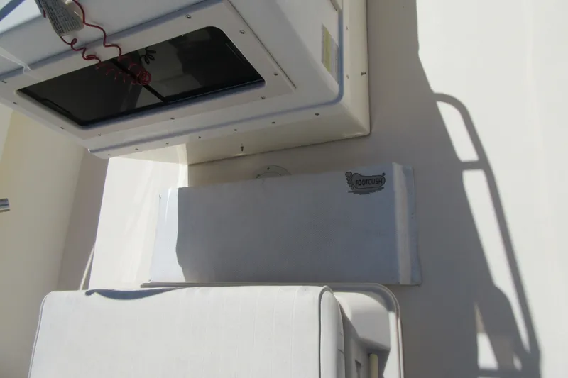 Slide: The Image of 2003 Parker 1801 Center Console boat interior with Footcush pad and storage compartment. - 27