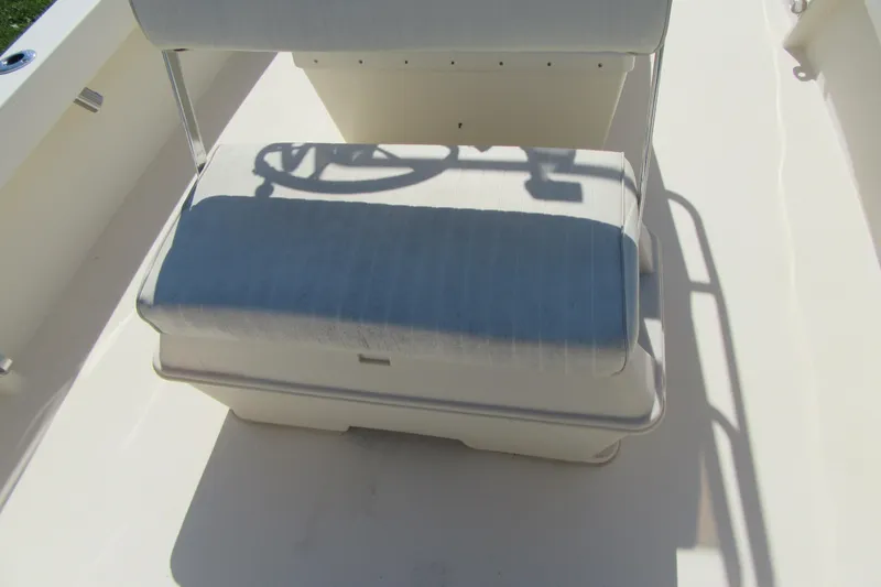 Slide: The Image of 2003 Parker 1801 Center Console boat seat with shadowed steering wheel. - 8