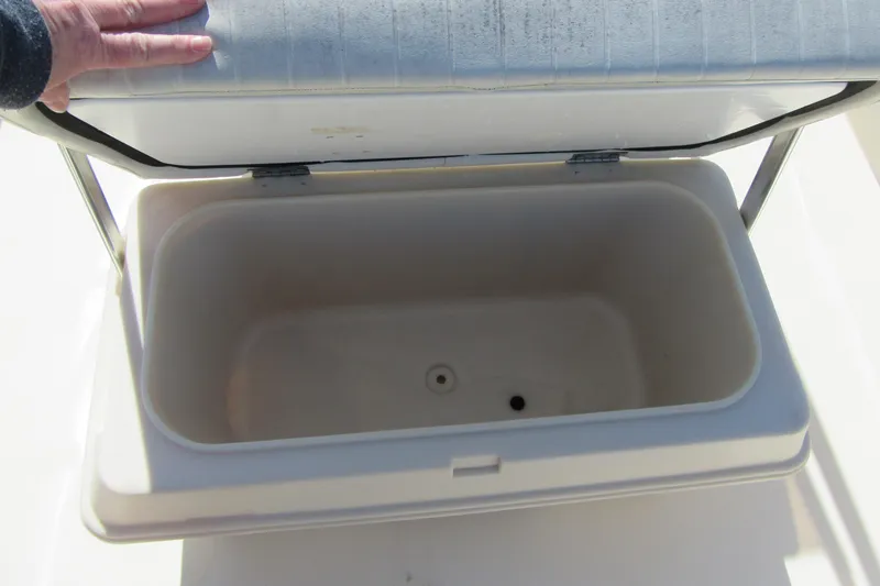 Slide: The Image of Open storage compartment on a 2003 Parker 1801 Center Console boat. - 9