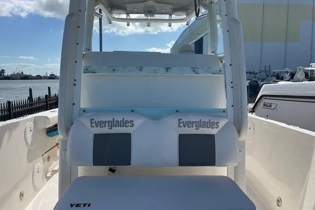 Slide: The Image of 2007 Everglades 240 Center Console boat interior with seating and Yeti cooler. - 2