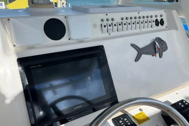 Slide: The Image of Dashboard of a 2007 Everglades 240 Center Console boat with Garmin display. - 9