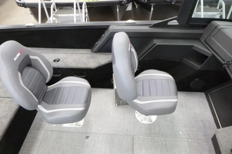 Slide: The Image of 2024 Alumacraft Competitor FSX 175 boat interior with two gray seats. - 10