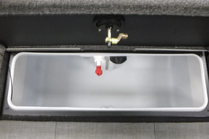 Slide: The Image of 2024 Alumacraft Competitor FSX 175 livewell interior with valve and drain system. - 13