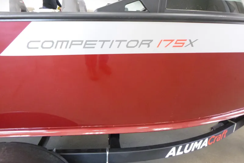 Slide: The Image of 2024 Alumacraft Competitor FSX 175 boat, red and white exterior detail. - 16