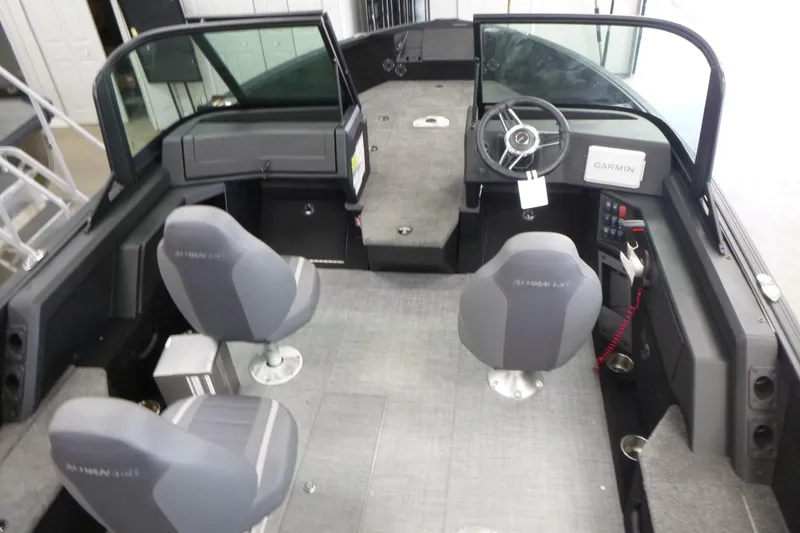 Slide: The Image of 2024 Alumacraft Competitor FSX 175 boat interior with seating and steering console. - 4