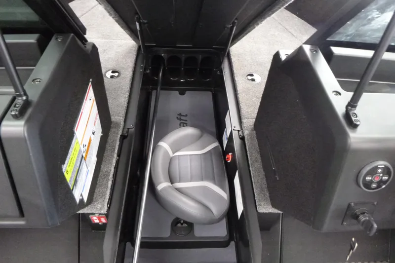 Slide: The Image of 2024 Alumacraft Competitor FSX 175 boat interior with storage compartment and seat. - 7