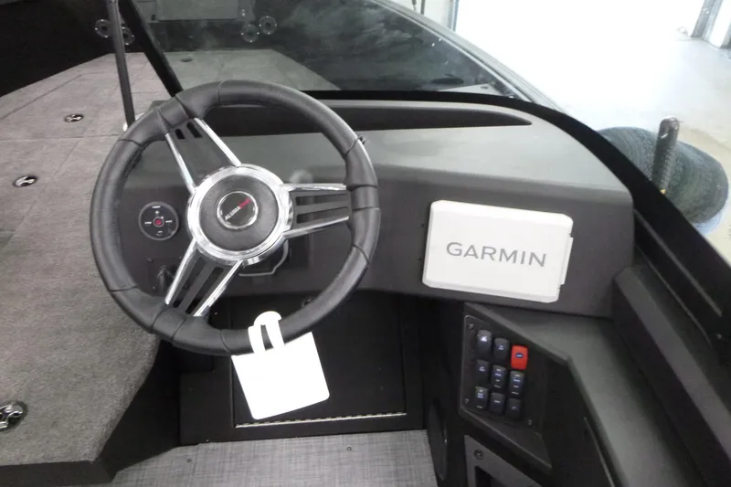 Slide: The Image of 2024 Alumacraft Competitor FSX 175 dashboard with Garmin navigation system and steering wheel. - 9