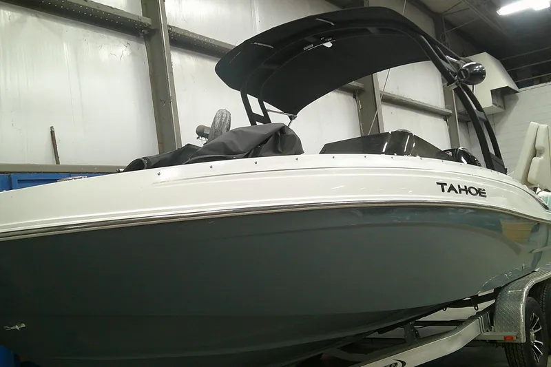 The Image of 2023 Tahoe T21 boat in showroom, featuring sleek design and modern features. - 0