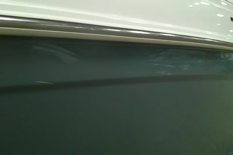 Slide: The Image of 2023 Tahoe T21 boat hull with sleek design and smooth finish. - 11