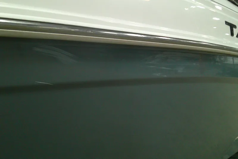 Slide: The Image of Close-up of 2023 Tahoe T21 boat hull with sleek design and glossy finish. - 12