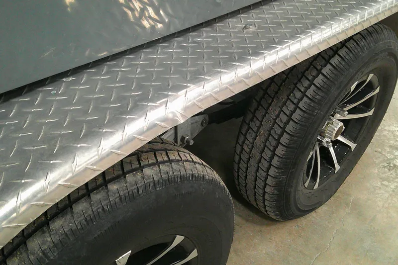 Slide: The Image of 2023 Tahoe T21 trailer with dual wheels and diamond plate fender. - 15