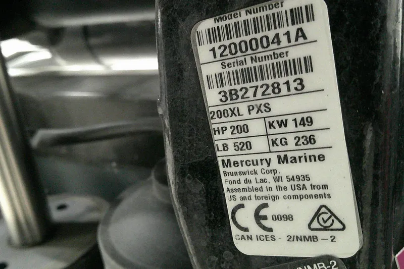 Slide: The Image of Label on Mercury Marine engine, showing model and serial numbers, horsepower, and weight details. - 9
