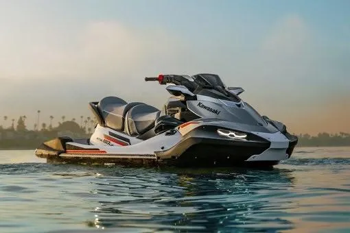Slide: The Image of 2026 Kawasaki Jet Ski STX on calm water at sunset. - 4