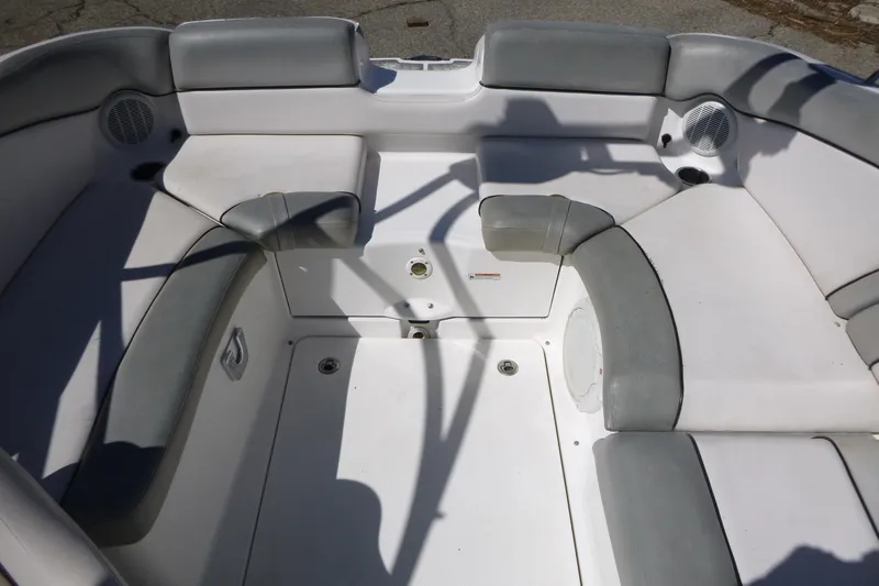 Slide: The Image of 2011 Yamaha Boats AR240 HO interior seating with gray and white upholstery. - 11