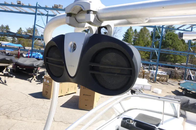 Slide: The Image of 2011 Yamaha Boats AR240 HO with mounted marine speakers on a sunny day. - 12