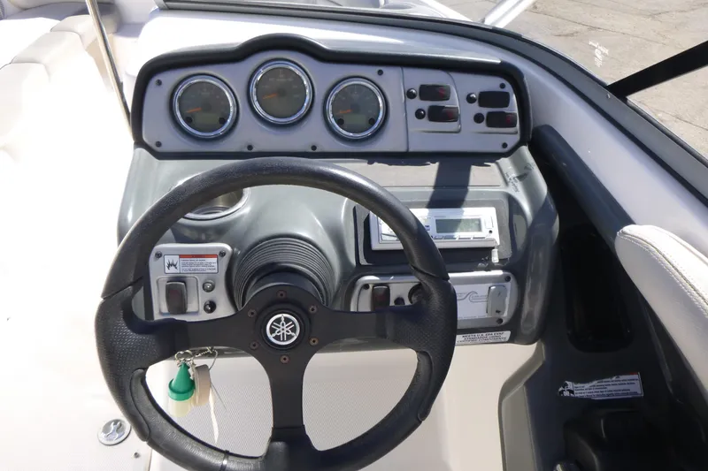 Slide: The Image of 2011 Yamaha Boats AR240 HO dashboard with steering wheel and instrument panel. - 8