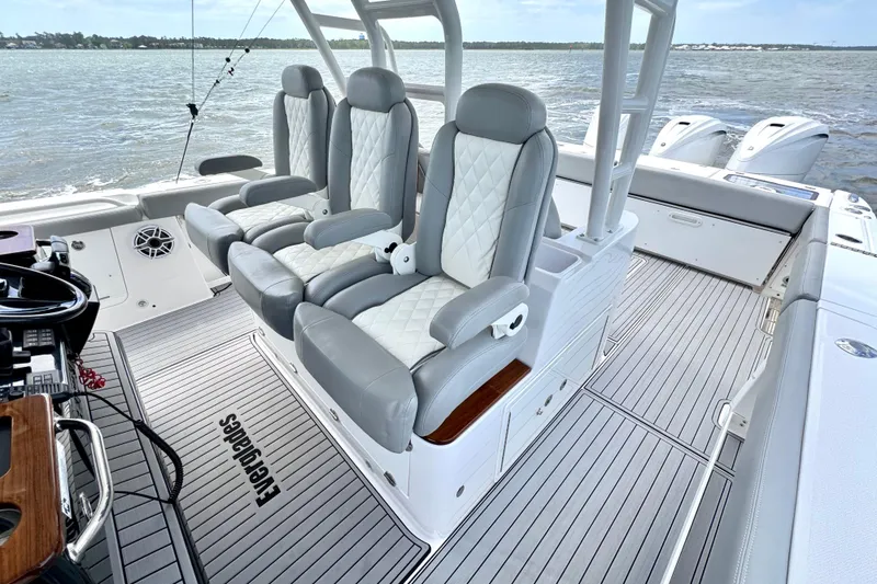 Slide: The Image of 2023 Everglades 395 Center Console boat interior with luxurious seating and sleek design. - 10