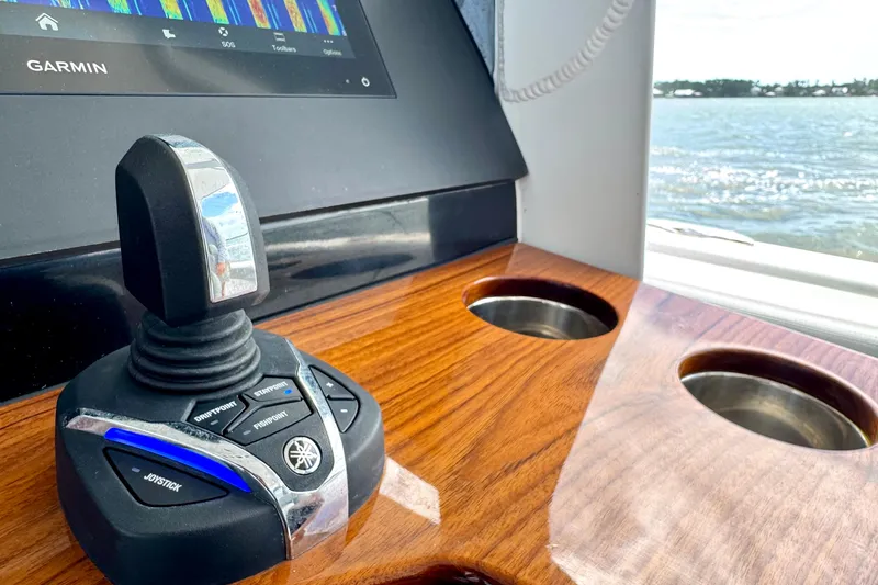 Slide: The Image of Joystick control on 2023 Everglades 395 Center Console boat with Garmin display. - 14
