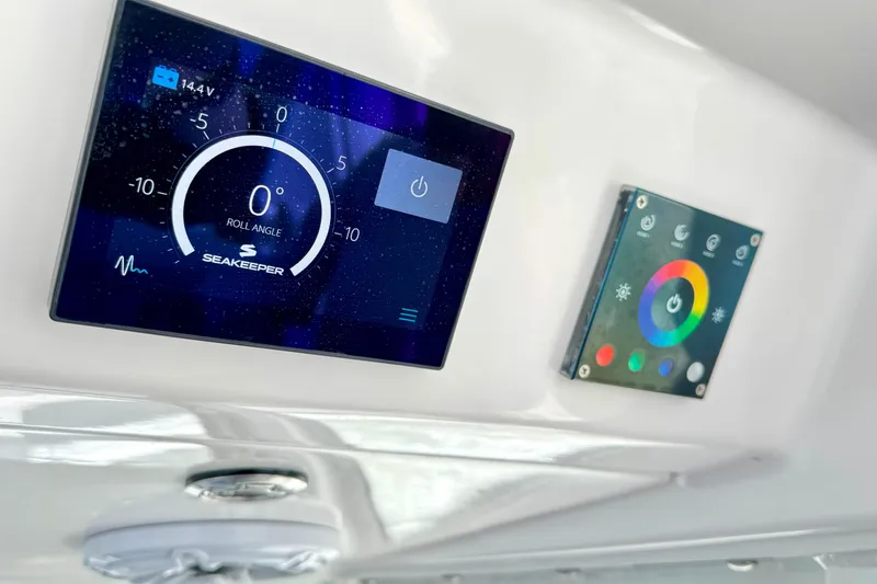 Slide: The Image of Control panel of 2023 Everglades 395 Center Console boat with Seakeeper display. - 16