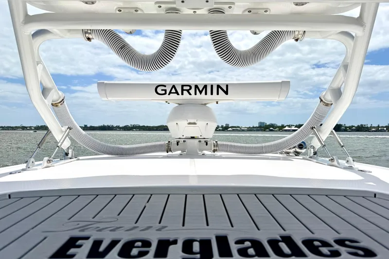 Slide: The Image of 2023 Everglades 395 Center Console boat with Garmin equipment on deck, ocean view. - 22