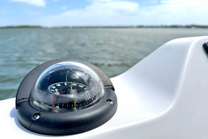 Slide: The Image of Compass on Everglades 395 Center Console boat, 2023 model, with ocean view. - 23