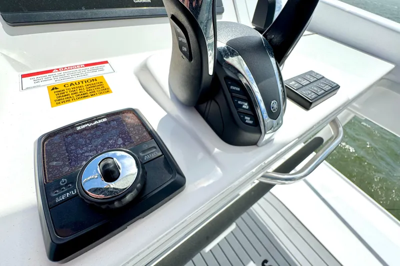 Slide: The Image of Control panel of 2023 Everglades 395 Center Console boat with navigation equipment. - 26