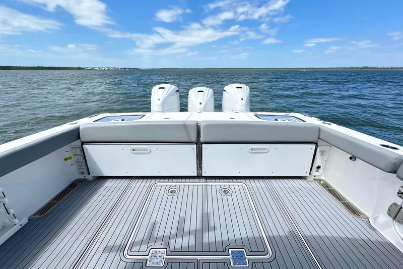 Slide: The Image of 2023 Everglades 395 Center Console boat deck with ocean view. - 27