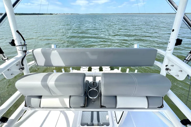 Slide: The Image of 2023 Everglades 395 Center Console boat with gray seating, ocean view. - 28