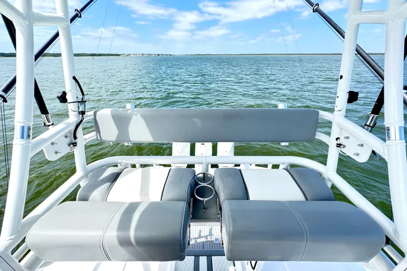 Slide: The Image of 2023 Everglades 395 Center Console boat interior with seating and ocean view. - 31