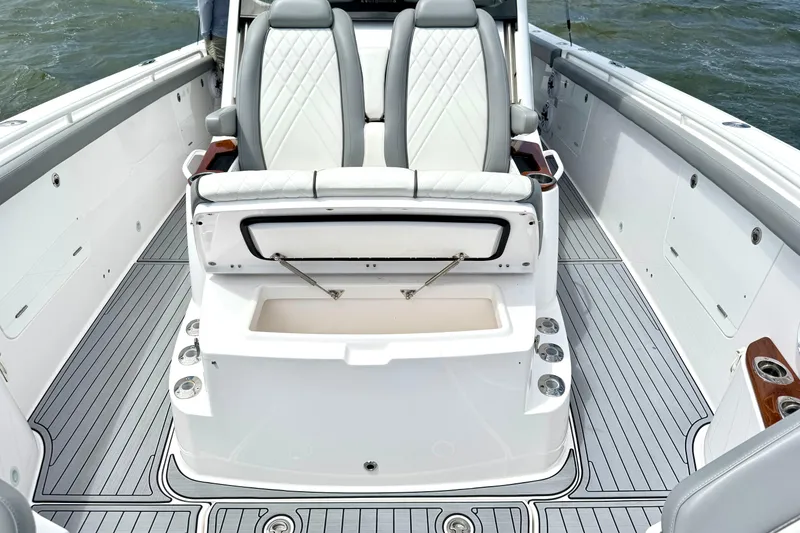Slide: The Image of 2023 Everglades 395 Center Console boat interior with seating and storage compartments. - 35