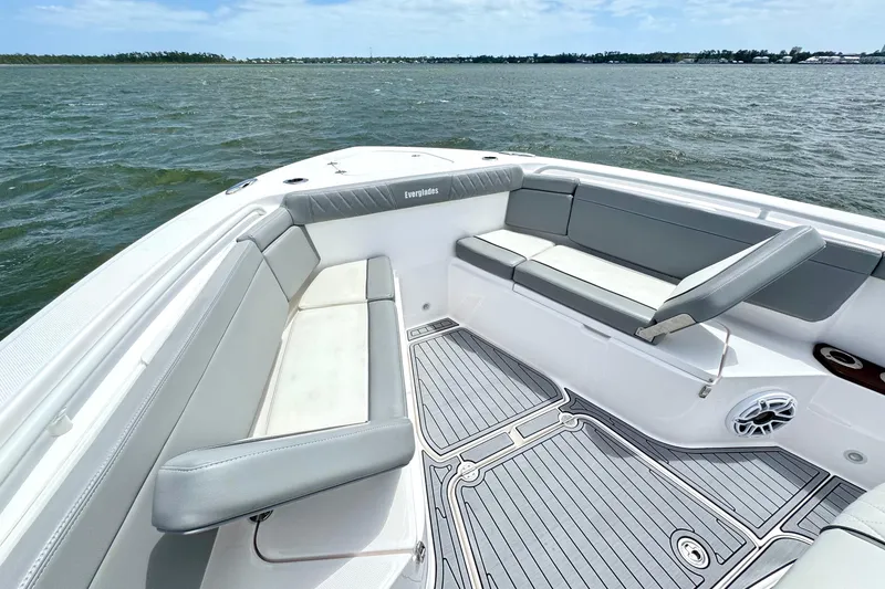 Slide: The Image of 2023 Everglades 395 Center Console boat interior with cushioned seating and ocean view. - 36